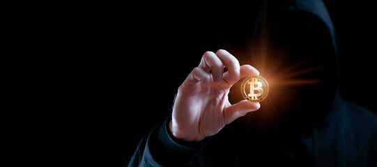 Crypto money bitcoin background. Crypto hacker hand hold golden BTC bit coin. Digital money, stock market concept.