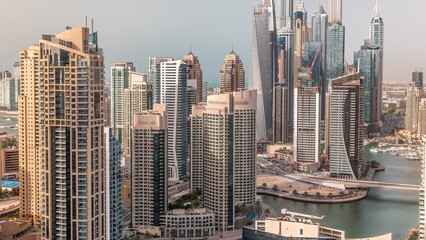 View of various skyscrapers in tallest recidential block in Dubai Marina aerial timelapse