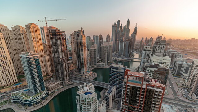 Panorama of various skyscrapers in tallest recidential block in Dubai Marina aerial timelapse