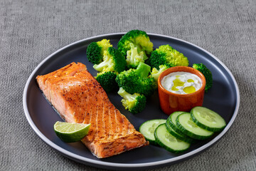 roast salmon fillet with boiled broccoli and sauce