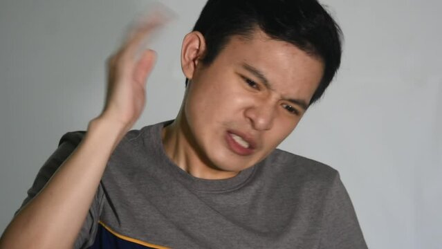 A Man With Ear Irritation