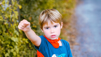 Little boy dressed as superman, super hero/Petit garçon déguisé en superman, super héros