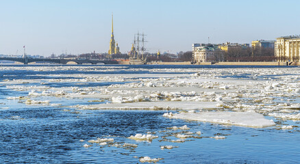 Spring ice drift on the Neva. Peter and Paul Fortress Trinity Bridge.