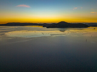 Clear skies sunrise and oyster leases