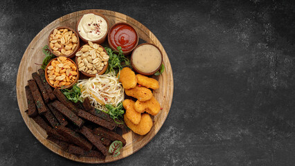 Beer snacks, peanuts, nuggets, squids, sauces, croutons
