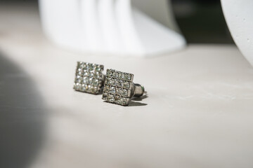 beautiful diamond earrings. Close-up of white diamond earrings.
