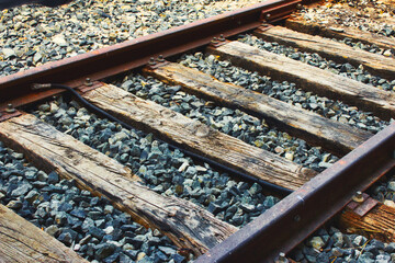 Close-up of train tracks, steel rails and wooden sleepers - Powered by Adobe