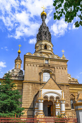 Obraz premium Mykolaiv, Ukraine - July 26, 2020: The building of the Cathedral of the Kasperovsky Icon of the Mother of God in Mykolaiv. Beautiful architecture of the Ukrainian Orthodox Church, vertical