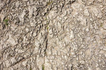 Zerklüftete Oberfläche eines anstehenden Felsens, Hintergrund, Muster, Textur.