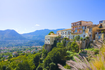 Fototapeta na wymiar View of Old Town in front of mountains in Monreale, Sicily, Italy