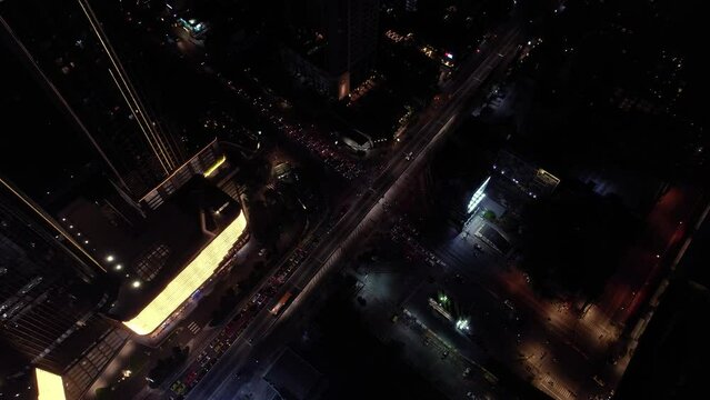 Hyperlapse time-lapse of car traffic transportation above  view in Asian city , Drone aerial view fly on  traffic on 4-way high angle. Public transport or commuter city life concept