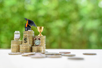 School funding, saving for higher education concept : Black graduation cap, campus diploma, US...
