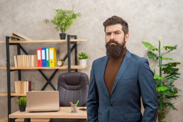 serious bearded businessman wear suit in the office with copy space, business