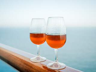 Beautiful glass with a drink. Side view, close-up. Vacation and travel concept. Moments of celebration