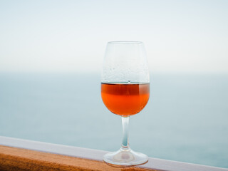 Beautiful glass with a drink. Side view, close-up. Vacation and travel concept. Moments of celebration
