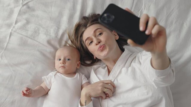 Mother with son using mobile for video call