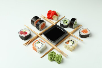 Concept of tasty food with sushi on white background