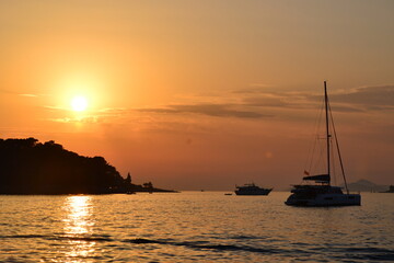 Naklejka na ściany i meble Yachts at sunset in Cavtat, Croatia
