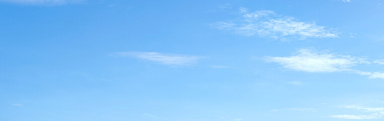 Blue sky with a thin white cloud