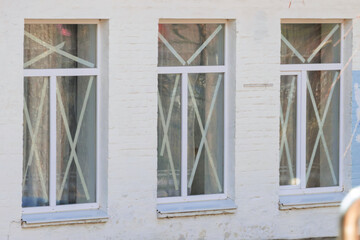 Windows sealed with adhesive tape from the blast wave in Ukraine
