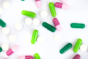 mixture of colorful medicinal capsules or medication in studio shot with copy space