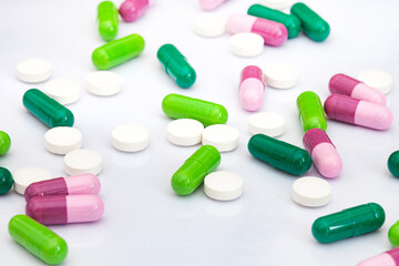 mixture of colorful medicinal capsules or medication in studio shot with copy space