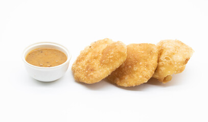 puri or luchi with souce over on white