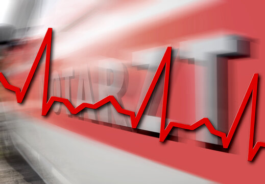 Closeup of an electrocardiogram line with the blur of an ambulance on the background