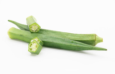 whole and pieces okra or Lady Finger design over on white background,