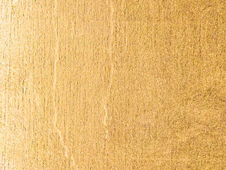 Worn yellow surface with vertical noise and cracks. Yellow background with texture. The old wall.
