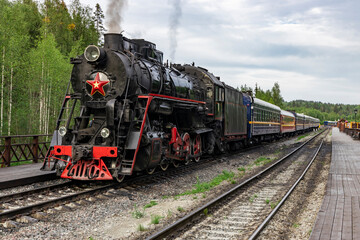 Fototapeta na wymiar Steam locomotive at the railway station in Karelia.