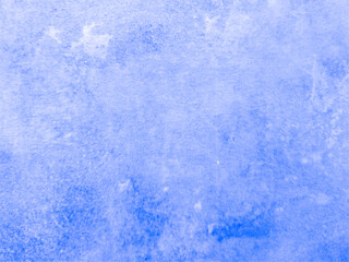 The smooth concrete wall is blue with spots. Blue background with texture. Worn surface.
