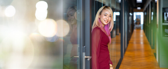 Portrait Attractive beautiful Asian business woman in suit working in home office.