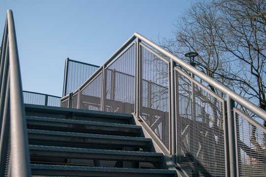 architecture: steel staircase of a pedestrian walkway, stainless steel structure, fireproof.