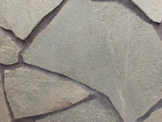 Gray background with a stone texture. Stone vintage wall. Close-up.
