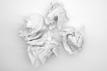 crumpled paper on white table brainstorming in the office concept                 