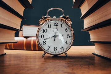 A stack of books and clock