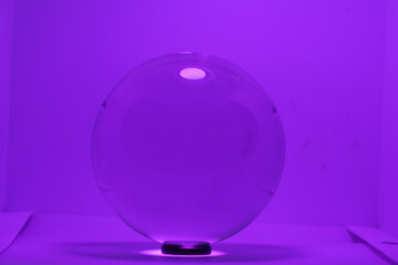 Purple crystal ball on a purple background