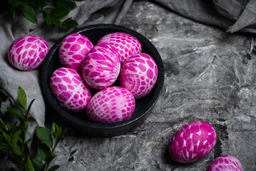 Lace pattern painted Easter eggs in a bowl top view