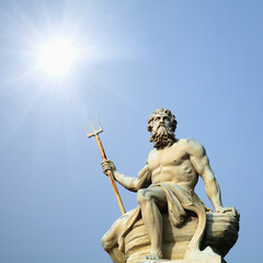 The mighty god of the sea and oceans Neptune (Poseidon) The ancient statue in the rays of the sun