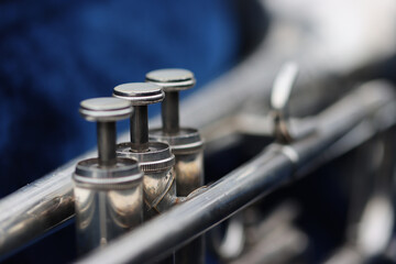 Selective focus shot of the details of a trumpet