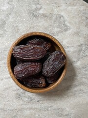 Ramadan dates in a wooden bowl