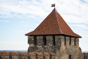 Fototapeta premium Walls and towers of a stone medieval fortress. Medieval fortress panorama. Fortress stone walls. Fortress landmark