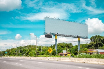 Outdoor billboard blank advertising big poster with blue sky background copy space. Advertising and business marketing background concept.