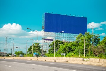 Outdoor billboard blank advertising big poster with blue sky background copy space. Advertising and business marketing background concept.