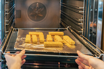 Semi-finished fish sticks. Junk food, convenience foods, fast food to warm up