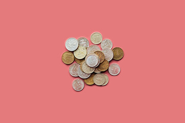 Pile of dirty russian rubles coins on pink background.