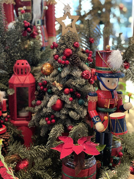 Vertical Shot Of A Little Drummer Boy And Christmas Decorations Displayed In A Store