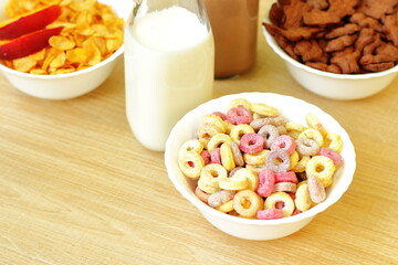 Bowls with different sorts of breakfast cereal products, white bowls with morning meal