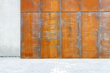 Modern rusty metal and concrete wall